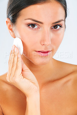 Buy stock photo Skincare, portrait and female model with a cotton pad in studio for a beauty, natural and face routine. Health, wellness and woman with health, wellness or cosmetic facial product by white background
