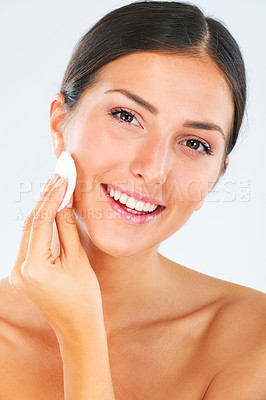 Buy stock photo Portrait of a woman with a cotton pad for skincare in studio for a beauty, natural and face routine. Health, wellness and happy female model with cosmetic facial product isolated by white background.
