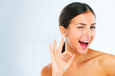 Buy stock photo Woman, portrait and OK hand gesture for beauty, happy with wink and skincare feedback or vote on white background. Mockup space, flirt and cosmetic care with playful model and dermatology approval