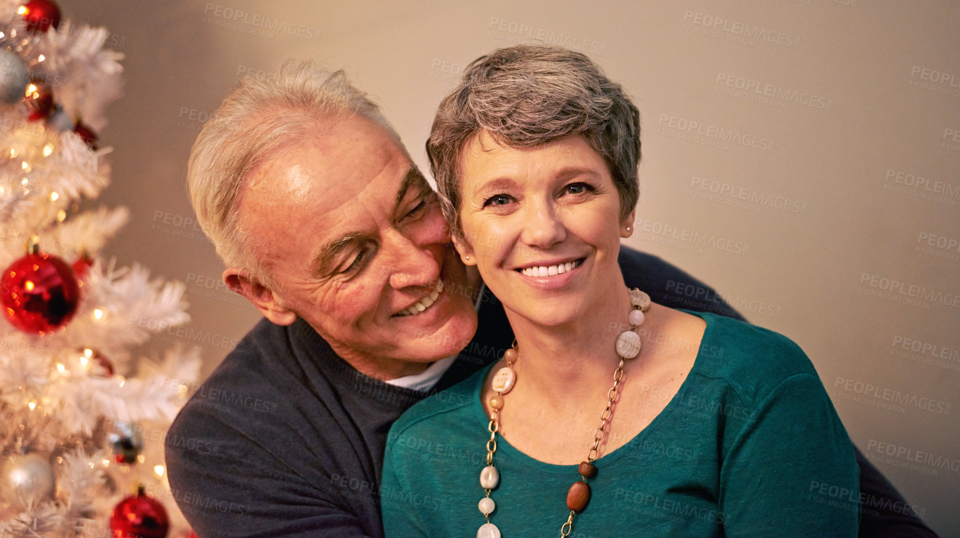 Buy stock photo Christmas, portrait and happy senior couple with love, care and support together in a home on holiday. Tree, retirement and marriage with smile and hug in house with celebration and romance with joy