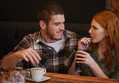 Buy stock photo Cropped shot of a loving young couple on a coffee date