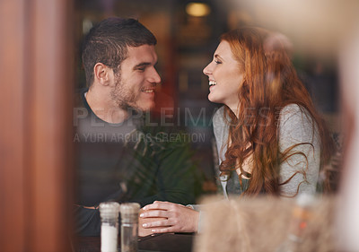 Buy stock photo Shot of a loving young couple on a coffee date