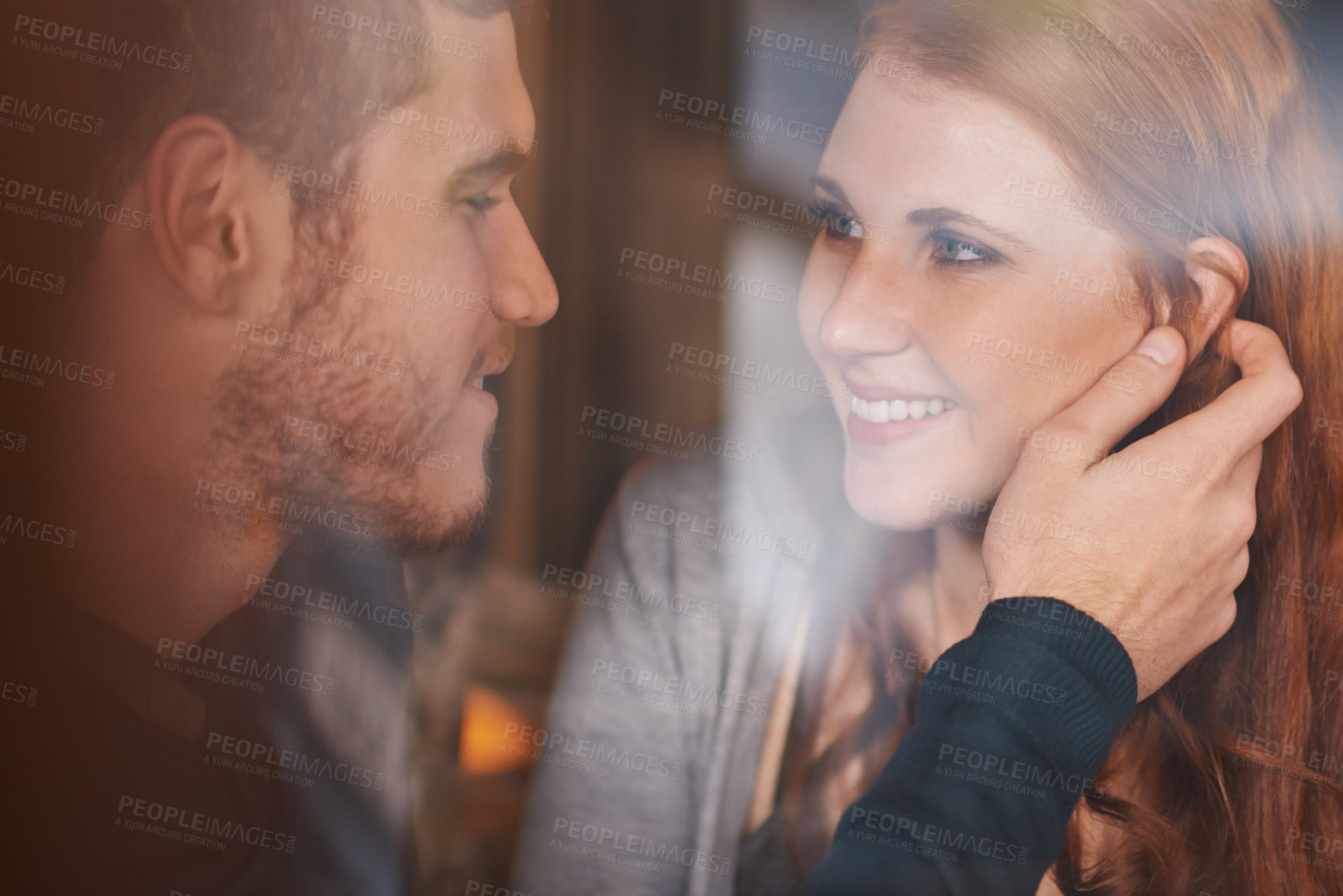 Buy stock photo Happy couple, love and support with affection at cafe for romance or care together at indoor restaurant. Face of man and woman with smile for date, relationship or romantic bonding at coffee shop