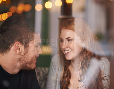 Buy stock photo Couple, happiness and love on date at cafe for bonding, romance and healthy relationship with relax. Man, woman and affection at coffee shop with smile, trust and window on anniversary vacation