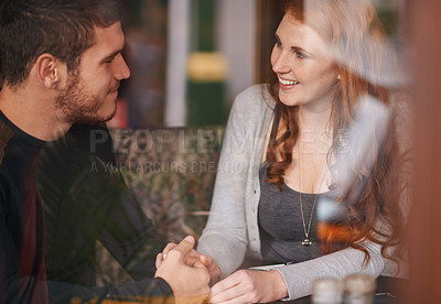 Buy stock photo Couple, smile and holding hands on date at cafe for bonding, romance and healthy relationship with relax. Man, woman and affection at coffee shop with happiness, trust or love on anniversary vacation