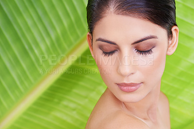 Buy stock photo Palm leaf, woman and beauty with makeup, relax and cosmetics with green background. Skincare, wellness and dermatology with a female person and natural skin glow with face treatment and lashes care