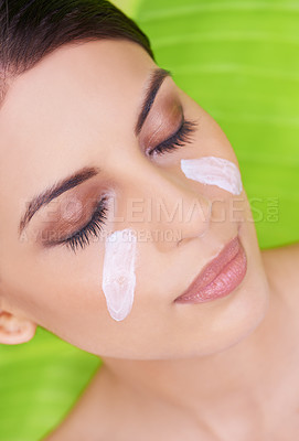 Buy stock photo Lotion, woman and beauty with palm leaf background, moisturizer and natural skincare with dermatology. Organic, nature and eco cosmetics with cream, sunscreen and eyeshadow with sustainable facial