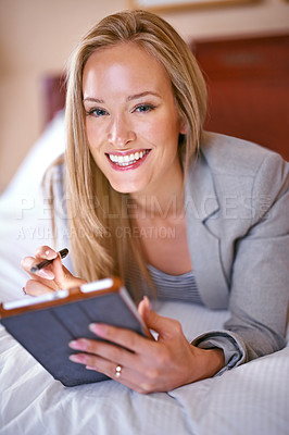 Buy stock photo Hotel, business and portrait of happy woman on tablet for website, social media and networking on bed. Online, remote work and person on digital tech for contact, research and internet on work trip