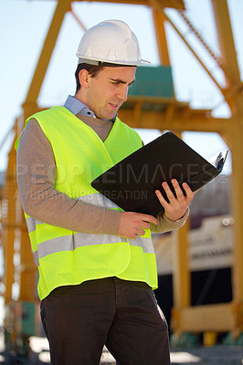 Buy stock photo Documents, construction site and man for inspection, reading building information or compliance folder outdoor. Engineering, architecture and person with industry checklist of project management