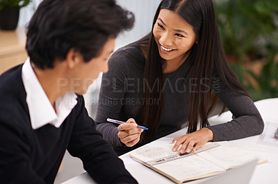 Buy stock photo Happy, asian business people and notes for teamwork in book and research on project in office. Japanese woman, man and hr consulting in collaboration, positive and writing for brainstorming by desk