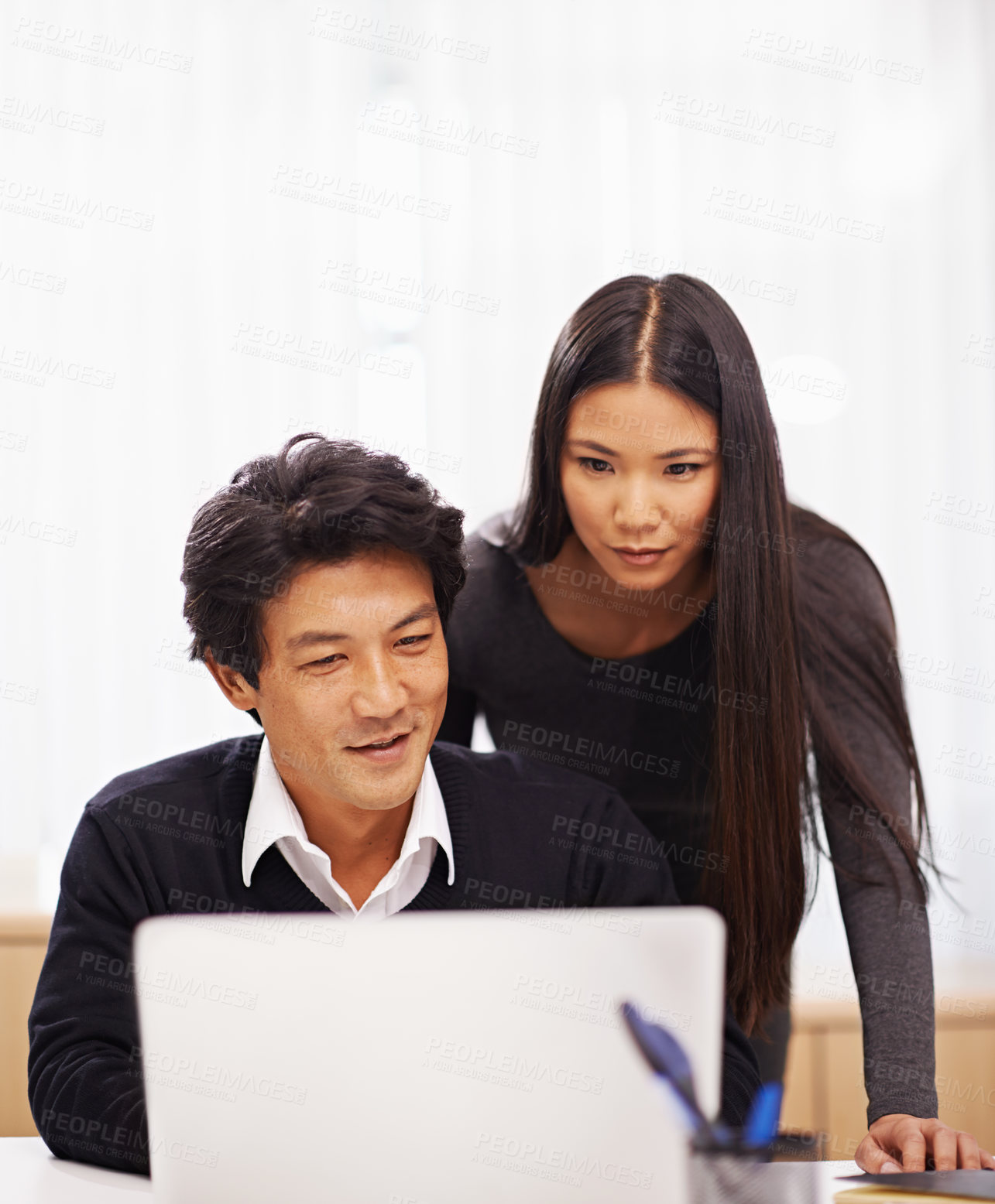 Buy stock photo Mentor, support and teamwork on laptop in office with businessman learning from help of woman. Feedback, advice and manager training asian man on computer in collaboration and reading online research
