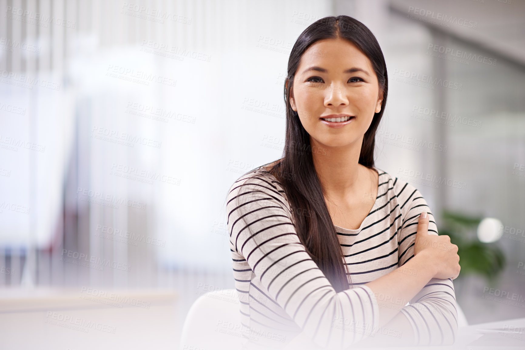 Buy stock photo Portrait of an attractive asian businesswoman sitting in her office