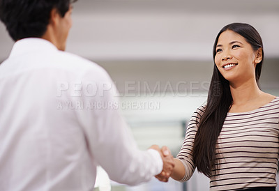 Buy stock photo Happy woman, handshake and meeting with employee in agreement, deal or proposal together at office. Young asian, female person or colleague shaking hands for b2b, greeting or partnership at workplace