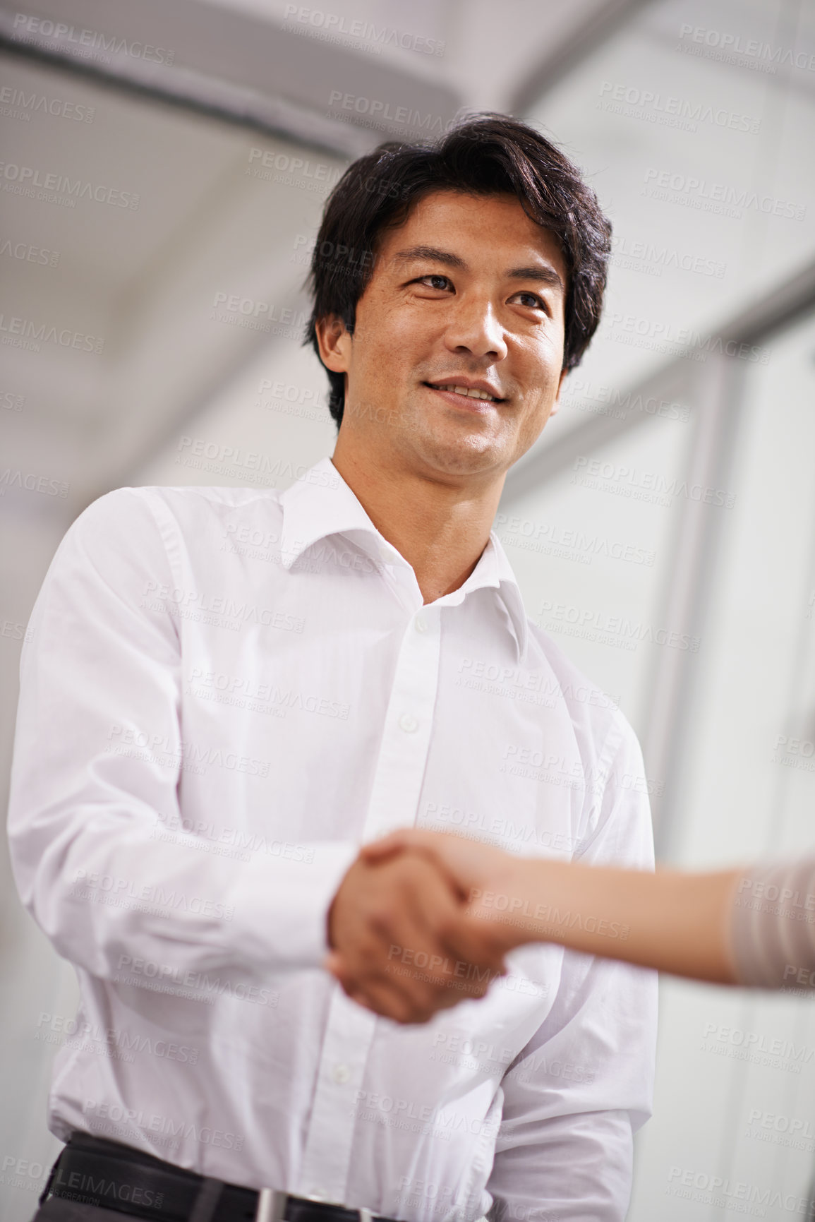 Buy stock photo Happy businessman, handshake and meeting with employee for agreement, deal or proposal together at office. Young asian man or colleague shaking hands for b2b, greeting or partnership at the workplace