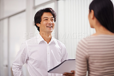 Buy stock photo Office, partnership and Asian business people in discussion, conversation and talking with documents. Meeting, creative agency and man and woman with project for planning, collaboration and teamwork