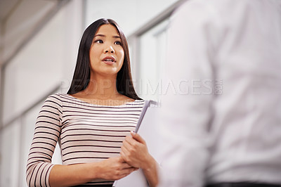 Buy stock photo Office, collaboration and Asian business people in discussion, conversation and talking with documents. Professional, creative agency and man and woman with project for planning, meeting and teamwork