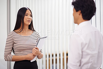 Buy stock photo Office, meeting and Asian business people in discussion, conversation and talking with documents. Professional, creative agency and man and woman with project for planning, collaboration and teamwork