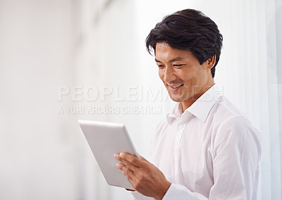 Buy stock photo Tablet, corporate and asian business man online for reading email, communication and internet research in office. Professional, technology and Japanese male employee for search, website and planning
