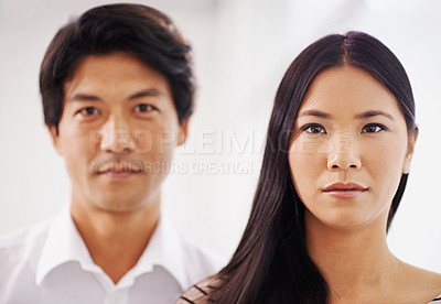 Buy stock photo Portrait, woman and Asian man in office, serious and employees in corporate company with teamwork. Collaboration, girl and male person working together as colleagues for project of startup business