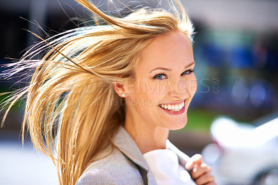 Buy stock photo Businesswoman, portrait and city walking with wind to office building or corporate professional, commute or urban. Female person, face and smile in New York or work trip in morning, street or career