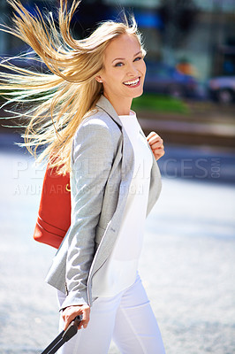 Buy stock photo Smile, luggage and businesswoman for urban commute, hair and travel to workplace on street. Portrait, walk and happiness for business consultant in New York, freelance or professional employee 