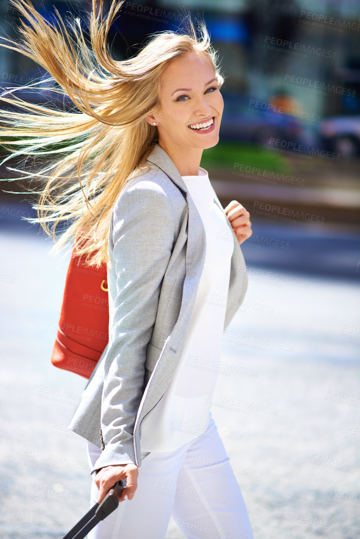 Buy stock photo Smile, luggage and businesswoman for urban commute, hair and travel to workplace on street. Portrait, walk and happiness for business consultant in New York, freelance or professional employee 