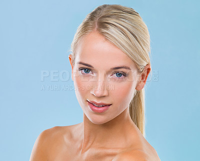 Buy stock photo Face, skincare and portrait of woman in studio with dermatology, glow and facial treatment. Happy, beauty and female model with health, wellness and cosmetic routine isolated by blue background.