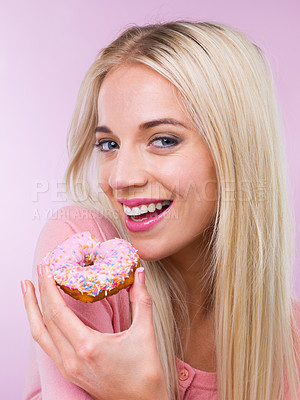 Buy stock photo Woman, beauty and studio portrait with donut with makeup, happy and pastry by pink background. Girl, person and model with sweets, bakery product or excited smile for eating with choice for fast food