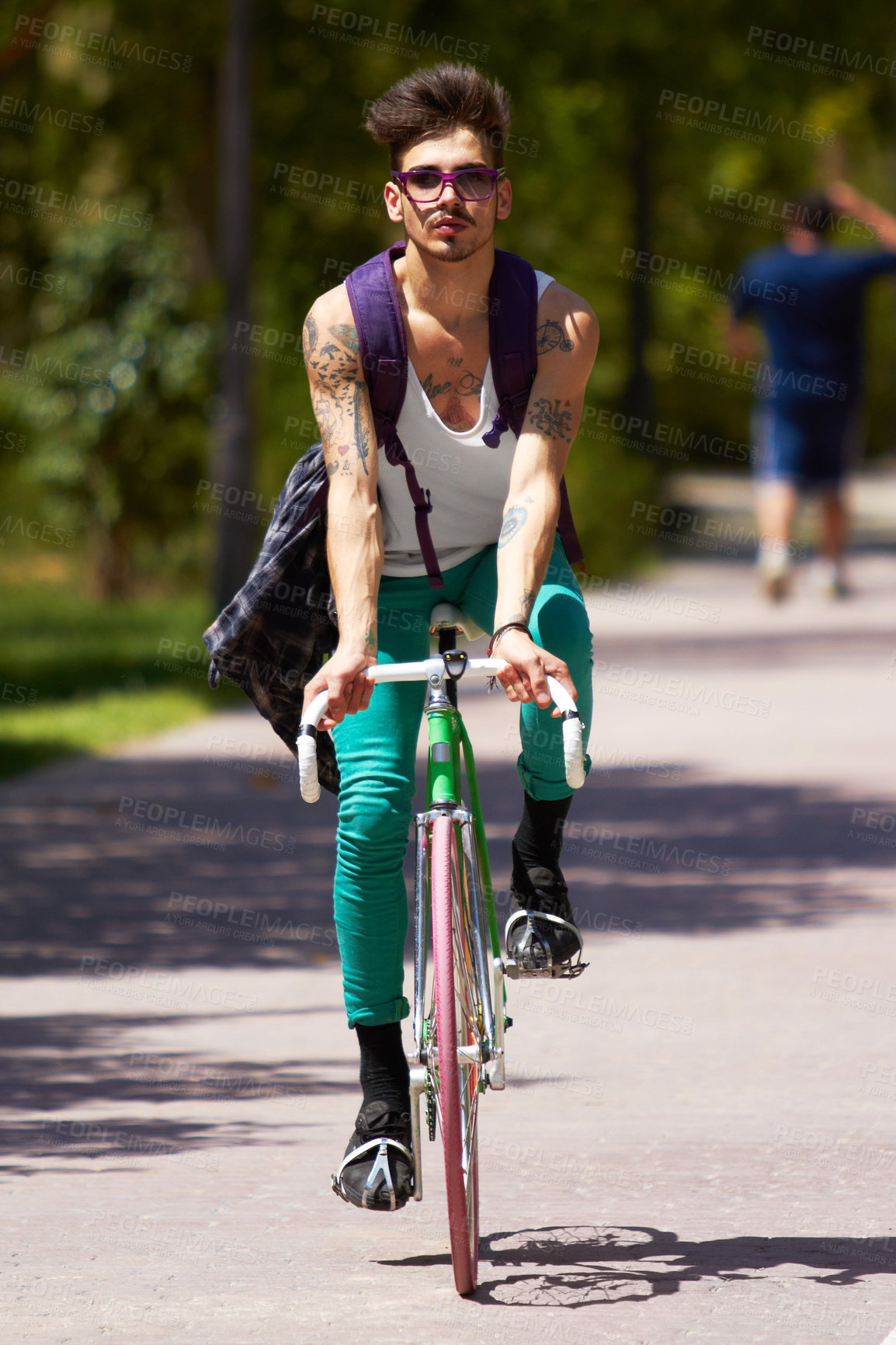 Buy stock photo Full length shot of a young guy cycling outdoors