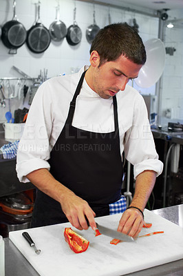 Buy stock photo Chef, cooking and cutting with man in kitchen for luxury, hospitality and food catering. Fine dining, gourmet and dinner with male cook in hotel restaurant for menu, cuisine and meal preparation