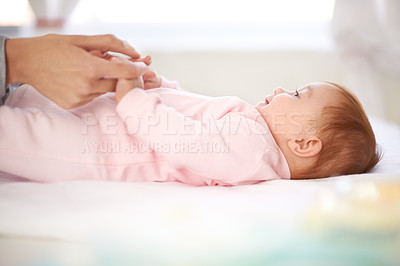 Buy stock photo Loving mother caring for her baby girl