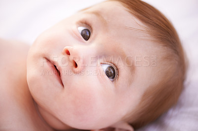 Buy stock photo Closeup, girl and baby on bed with thinking for childhood development, growth and relax in nursery. Ginger, newborn and kid with wonder for wellness, curiosity or waking up in bedroom from above