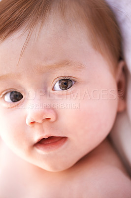 Buy stock photo Closeup, kid and baby on bed with thinking for childhood development, growth and relax at home. Newborn, ginger and girl with curiosity for knowledge, wonder or waking up in nursery from above