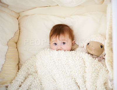 Buy stock photo High angle shot of an adorable baby in a cot