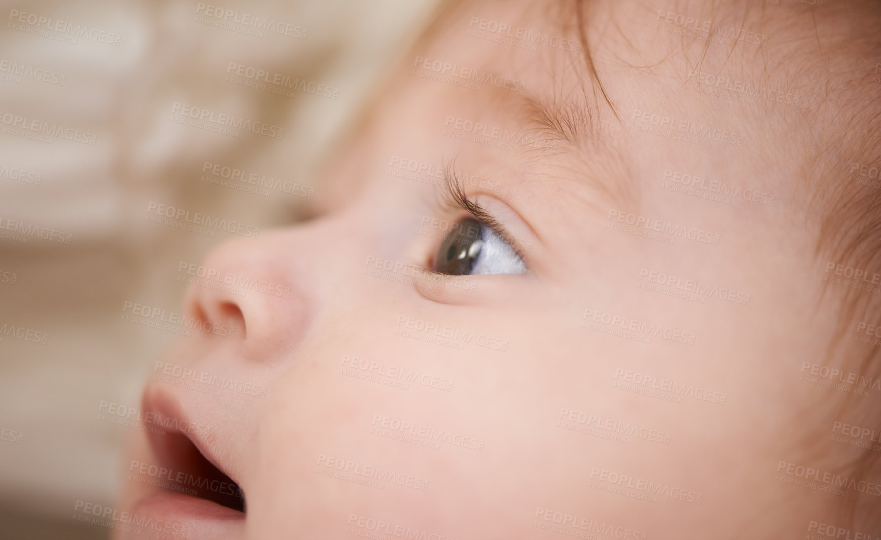 Buy stock photo Newborn, closeup and baby with thinking for curiosity, childhood development and growth in bedroom. Adorable, healthy kid and cute infant with smile to relax, wonder or waking up in nursery at home