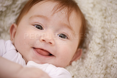 Buy stock photo Happy, cute and portrait of baby on blanket playing for child development and positive face. Smile, sweet and closeup of girl kid, infant or newborn relaxing and laying on bed in nursery room at home
