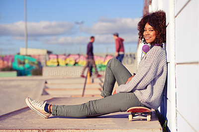 Buy stock photo Portrait, happy woman and skateboard in city by wall in summer for sport, fashion or relax outdoor. Smile, skate park and gen z girl or young person in casual clothes with headphones in South Africa