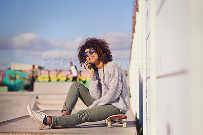 Buy stock photo Shot of a young woman out skateboarding in the city