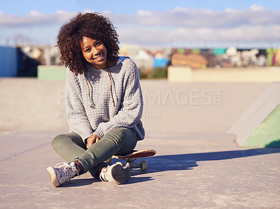 Buy stock photo Shot of a young woman in a skate park