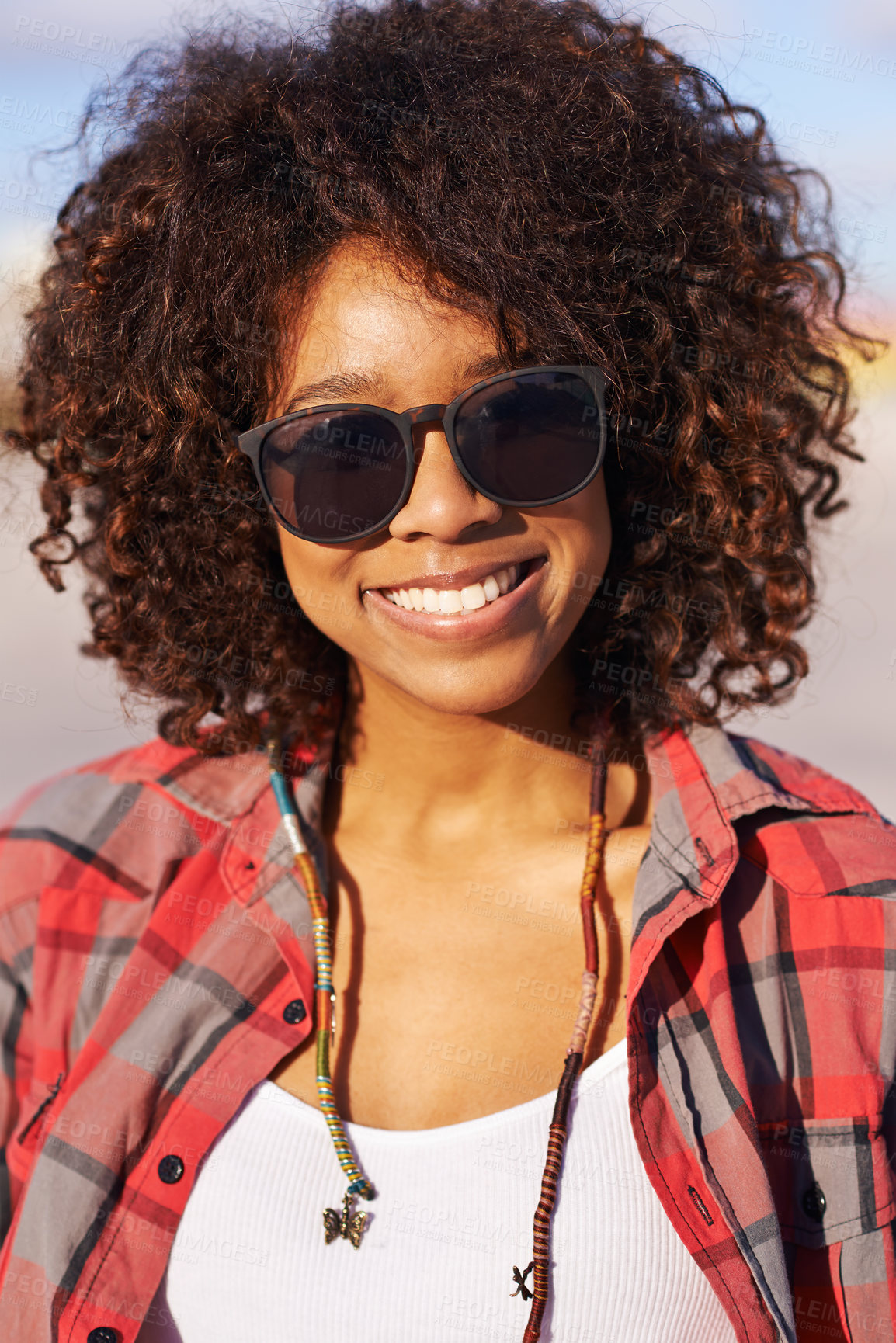 Buy stock photo Fashion, portrait and black woman with sunglasses for trendy, edgy and hipster clothing in city of San Francisco. Smile, afro and face of female person for style, eyewear and confidence in park