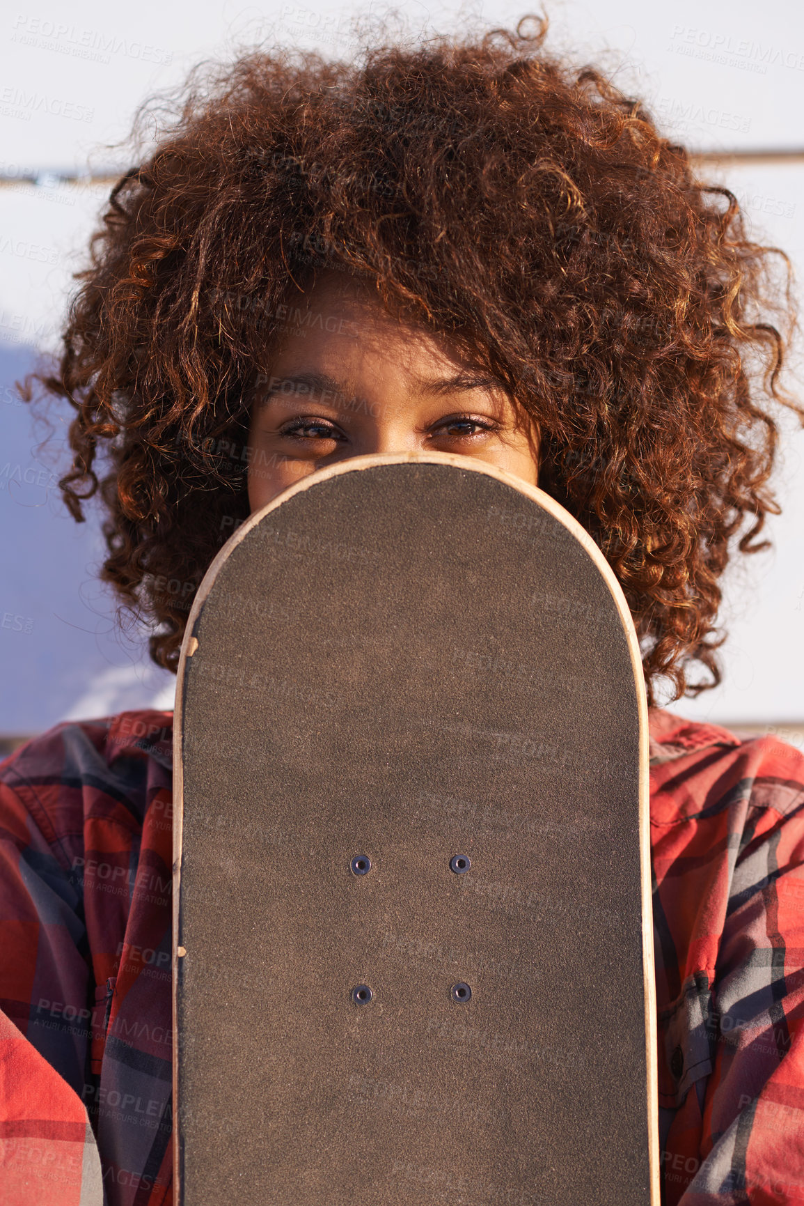 Buy stock photo Hide, face and portrait of woman with skateboard for fitness, urban and hiding in outdoors. Training, skating and youth with african female skater and cover for hipster, relax and skateboarder afro