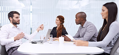 Buy stock photo A group of colleagues sitting in an office meeting