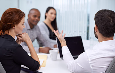 Buy stock photo A group of coworkers having a meeting
