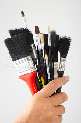 Buy stock photo Paint brush, hand closeup and creativity tool for art or contractor work in a home. Creative start, painter and person or artist tools for house renovation, canvas construction and decor equipment