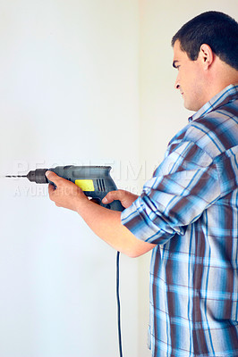 Buy stock photo Wall drill, home and man with renovation, construction work or house improvement for maintenance, repair or builder project. Contractor, handyman or male technician with electric tools for drilling