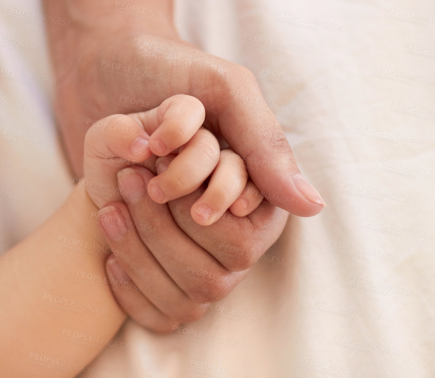 Buy stock photo Parent, baby and holding hand for comfort on bed for love, trust or support in bond. Person, infant and caring with touch for child development, growth or health in wellness for quality time together