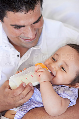 Buy stock photo Baby laugh, feeding and dad with child at home with a bottle of milk with happiness with kids. Family, young child and drink for growth and development with father bonding and happy in a house