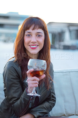Buy stock photo Shot of a beautiful woman holding an alcoholic beverage