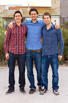 Buy stock photo Portrait of a group of young men standing outdoors