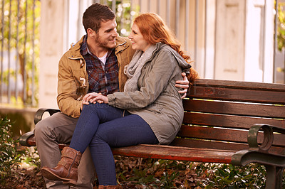 Buy stock photo Couple, love and sitting with hug at park in cold weather or winter, together and smile in London. Relationship, commitment and bonding for romance with soulmate, care and happiness on holiday